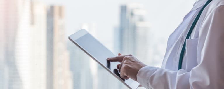 Doctor touching tablet