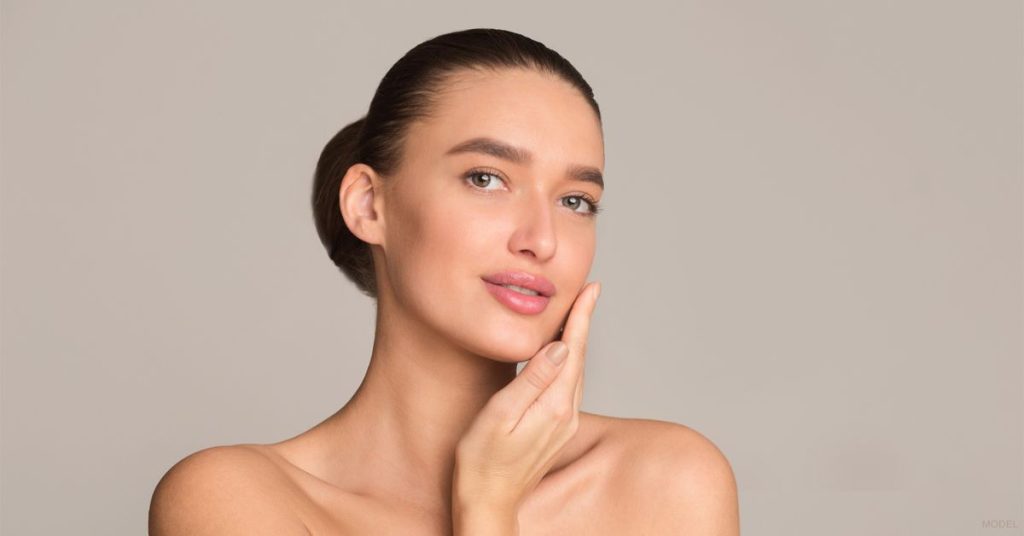 Woman after masseter BOTOX. (Model)